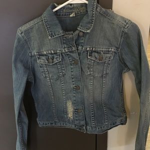 Distressed and embellished jean jacket